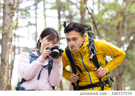 Couple enjoying hiking and photography Couple enjoying hiking and photography 106557559