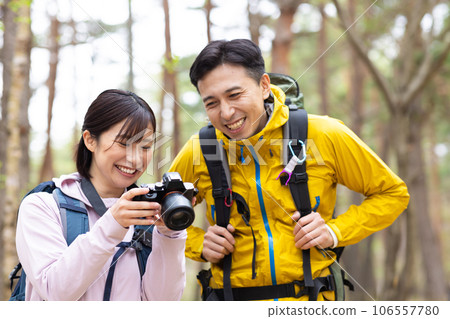Couple enjoying hiking and photography Couple enjoying hiking and photography 106557780