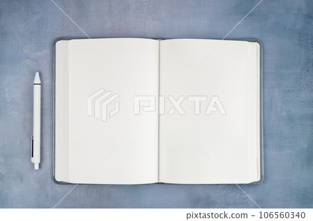 The Empty open notebook on blue old wooden table. The Empty open notebook on blue old wooden table. 106560340