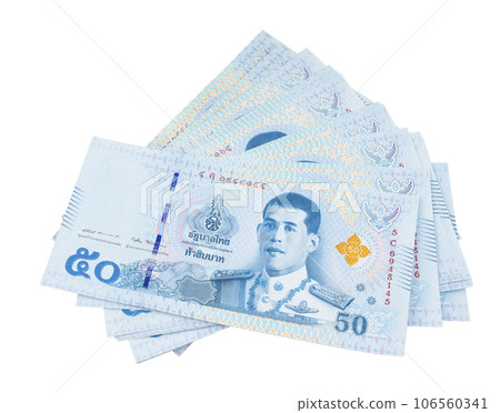 The Stack of Thailand 50 baht banknotes latest design during the reign of king rama 10 isolated on white background. The Stack of Thailand 50 baht banknotes latest design during the reign of king rama 10 isolated on white background. 106560341