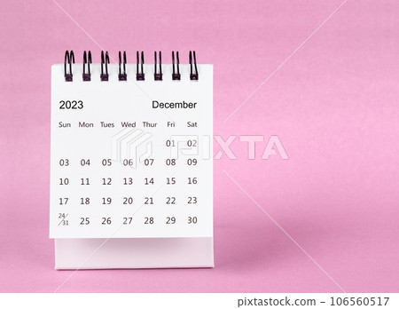 December 2023 desk calendar on pink color background. December 2023 desk calendar on pink color background. 106560517