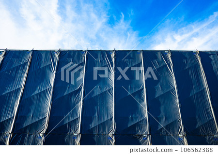 Building under repair work Sunlight shining on the protective curtain b-2 High chroma contrast 106562388
