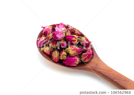 Dried roses for tea on white background. Dried roses for tea on white background. 106562968