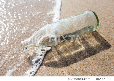 Glass bottle on the beach Glass bottle on the beach 106563020