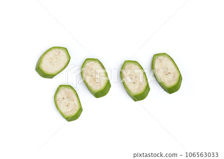 Raw banana slices on white background. Raw banana slices on white background. 106563033
