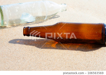 Glass bottles on the beach Glass bottles on the beach 106563569