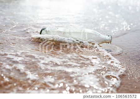 Glass bottle on the beach Glass bottle on the beach 106563572