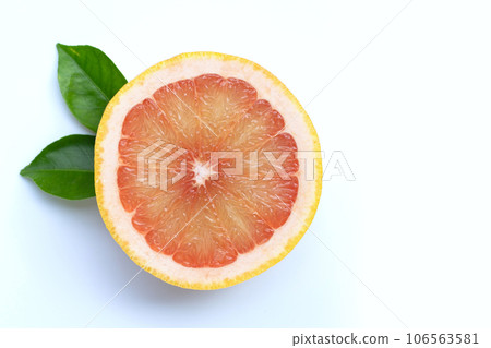 High vitamin C. Juicy grapefruit with leaves on white background. Copy space High vitamin C. Juicy grapefruit with leaves on white background. Copy space 106563581