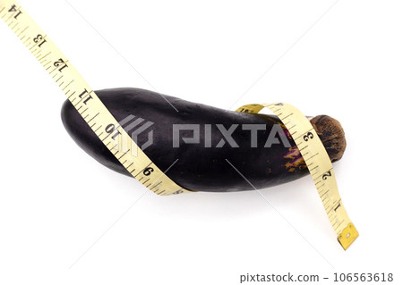 Eggplant with measuring tape on white background. Eggplant with measuring tape on white background. 106563618