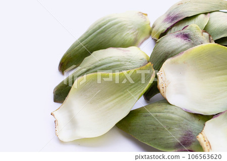 Fresh artichoke petals on white background 106563620