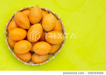 Marian plum fruit isolated on green background Marian plum fruit isolated on green background 106564080