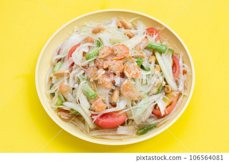 Dish of spicy papaya salad on white. Dish of spicy papaya salad on white. 106564081