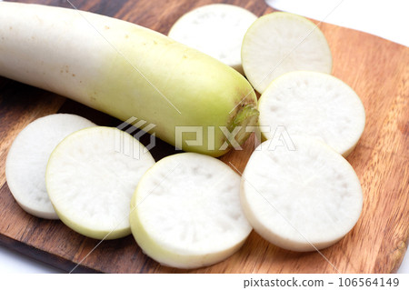 Sliced Japanese daikon. Fresh vegetables 106564149