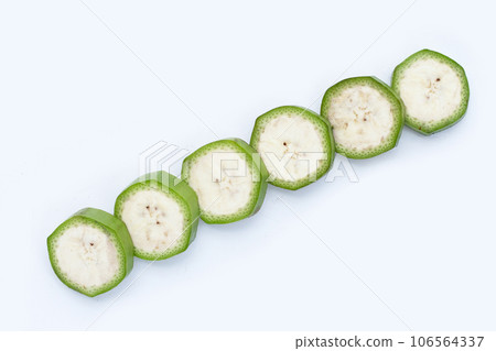 Raw banana slices on white background. Raw banana slices on white background. 106564337