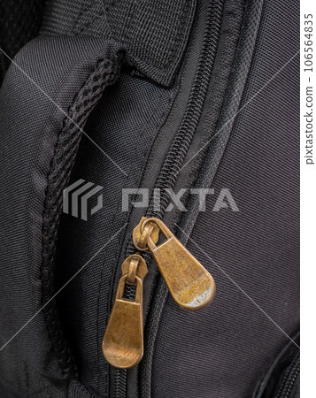 Detail of a zipper on a guitar bag, close up shot Detail of a zipper on a guitar bag, close up shot 106564835