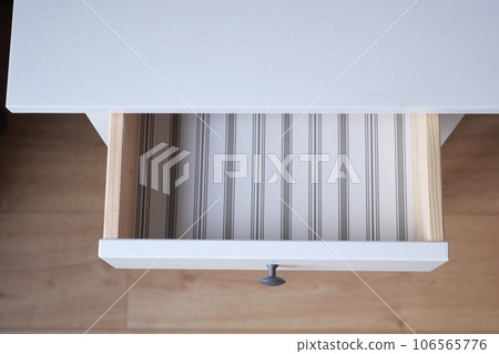 top view of a opened empty drawer  106565776