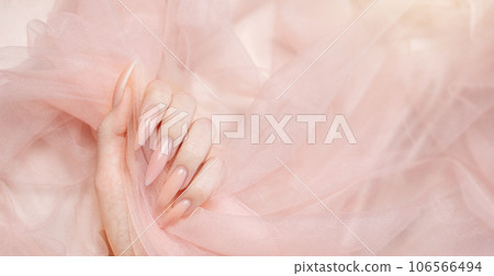 Elegant pastel pink natural manicure. Elegant pastel pink natural manicure. 106566494