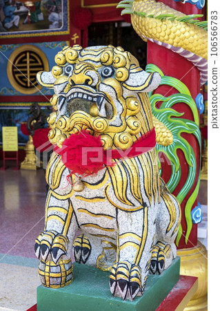 This brightly colored stone lion represents the Chinese and East Asian belief that bright colors symbolize prosperity and good luck. The bright colors of this stone lion will help attract good luck. This brightly colored stone lion represents the Chinese and East Asian belief that bright colors symbolize prosperity and good luck. The bright colors of this stone lion will help attract good luck. 106566783