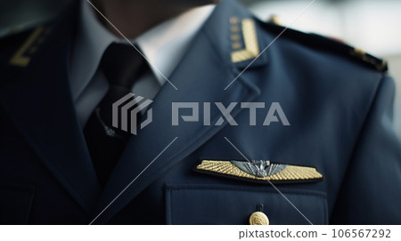 Close-up of pilot's uniform (no face) 106567292