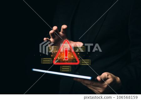 Man hand holding tablet protecting system warning caution sign for notification error. Cyber attack on computer network. 106568159