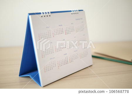calendar page close up on wood table background with pencil and notebook business planning appointment meeting concept 106568778