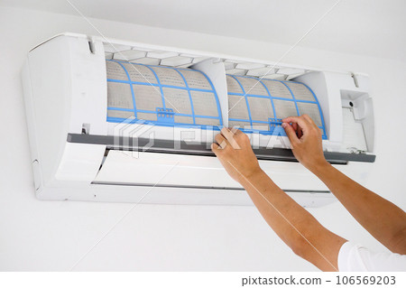 Asian man cleaning air conditioner dirty filter Asian man cleaning air conditioner dirty filter 106569203