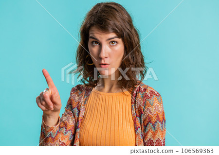Woman reacting to unpleasant awful idea, dissatisfied, wave hand, shake head No, dismiss idea 106569363