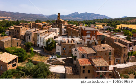 Drone view of Spanish township of Figuerola d Orcau on background of mountain range 106569689