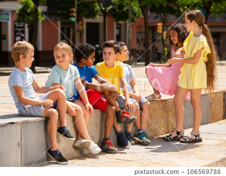 Company of children are communicating on walk in the street Company of children are communicating on walk in the street 106569788