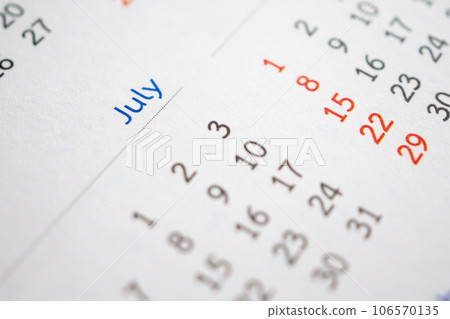 July calendar page with months and dates business planning appointment meeting concept 106570135