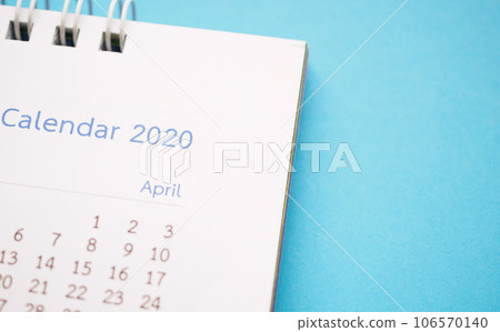 calendar page 2020 close up on blue background business planning appointment meeting concept 106570140