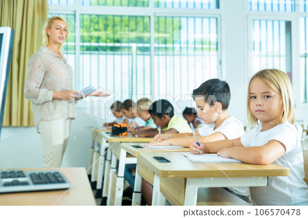 Side view of group of elementary school students Side view of group of elementary school students 106570478