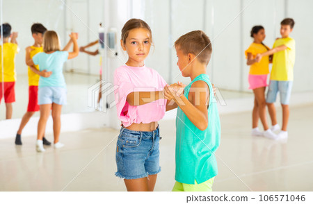 Boys and girls enjoying active dance in studio Boys and girls enjoying active dance in studio 106571046