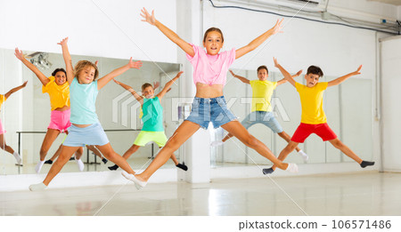 Kids jumping in dance studio Kids jumping in dance studio 106571486