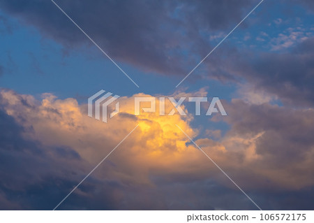 Colorful sunset or sunrise in the sky. The clouds are brightly colored. Beautiful background. Colorful sunset or sunrise in the sky. The clouds are brightly colored. Beautiful background. 106572175