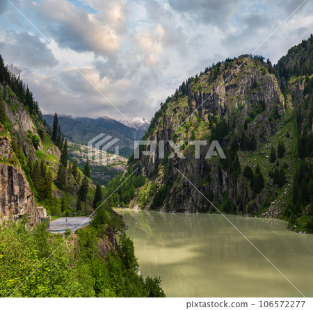Summer Alps mountain reservoir lake, Switzerland Summer Alps mountain reservoir lake, Switzerland 106572277