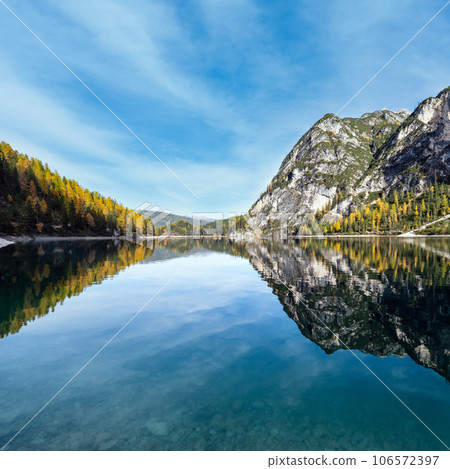 Autumn peaceful alpine lake Braies or Pragser Wildsee. Fanes-Sennes-Prags national park, South Tyrol, Dolomites Alps, Italy, Europe. Picturesque traveling, seasonal and nature beauty concept scene. 106572397