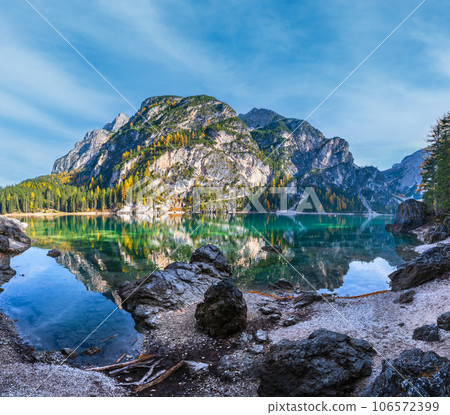 Autumn peaceful alpine lake Braies or Pragser Wildsee. Fanes-Sennes-Prags national park, South Tyrol, Dolomites Alps, Italy, Europe. Picturesque traveling, seasonal and nature beauty concept scene. 106572399