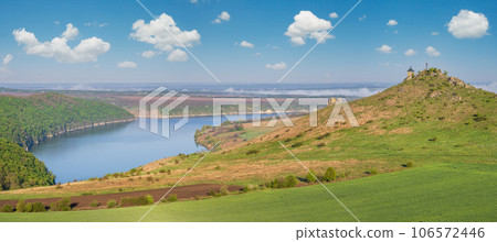Ukraine without russian aggression. Amazing spring view on the Dnister River Canyon with picturesque rocks, fields, flowers. This place named Shyshkovi Gorby, Nahoriany, Chernivtsi region, Ukraine. Ukraine without russian aggression. Amazing spring view on the Dnister River Canyon with picturesque rocks, fields, flowers. This place named Shyshkovi Gorby, Nahoriany, Chernivtsi region, Ukraine. 106572446