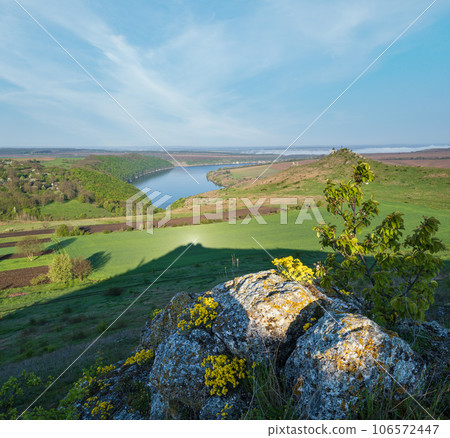 Amazing spring view on the Dnister River Canyon with picturesque rocks, fields, flowers. This place named Shyshkovi Gorby, Nahoriany, Chernivtsi region, Ukraine. Amazing spring view on the Dnister River Canyon with picturesque rocks, fields, flowers. This place named Shyshkovi Gorby, Nahoriany, Chernivtsi region, Ukraine. 106572447