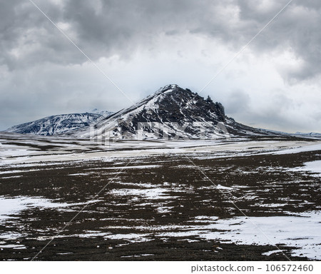 Colorful Landmannalaugar mountains under snow cover in autumn, Iceland. Lava fields of volcanic sand in the foreground. 106572460