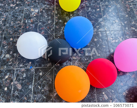 Different color balloons on the floor on the balcony on a sunny day 106573071