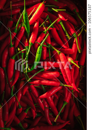 Sunlight shines on the chili peppers. 106575187