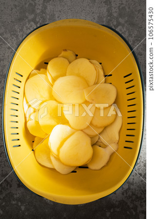 Sunlight shines on the potato slices. Sunlight shines on the potato slices. 106575430