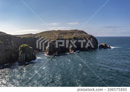 Aerial view of cliffs and sea stacks on Owey Island, County Donegal, Ireland Aerial view of cliffs and sea stacks on Owey Island, County Donegal, Ireland 106575893