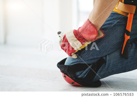 Installation foreman performing repair on floor Installation foreman performing repair on floor 106576583