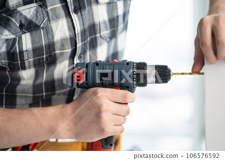 Furniture master drilling chipboard with drill Furniture master drilling chipboard with drill 106576592
