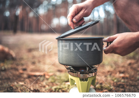 Cooking in the camping in the wood Cooking in the camping in the wood 106576670