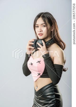 young beautiful asian woman with headphones young beautiful asian woman with headphones 106577858