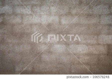 Wet brick wall of a house. Cement plaster Wet brick wall of a house. Cement plaster 106578248